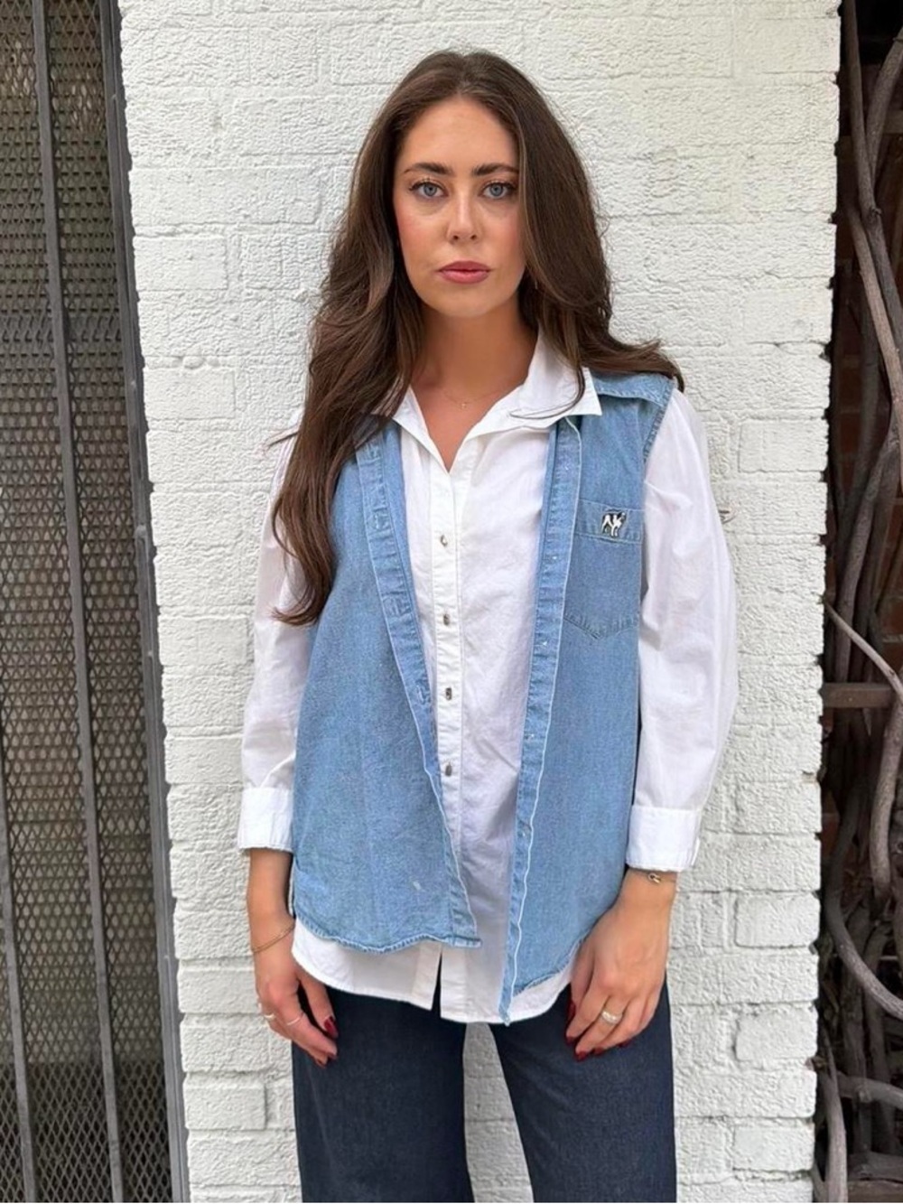 Vtg Blue denim vest with embroidered dog logo sz L / has a few marks on the fron